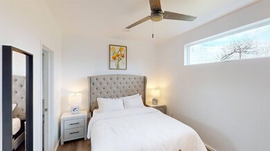 Bedroom featuring wood finished floors and ceiling fan