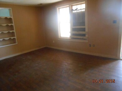 living room has laminate floors