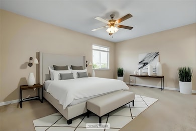 Bedroom with baseboards, light carpet, and a ceil