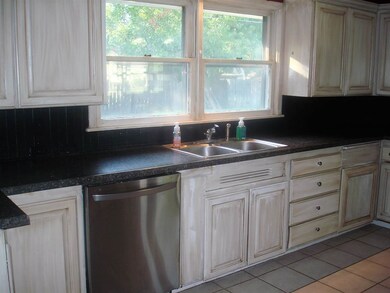 Refinished ivory cabinetry with oil rubbed finish!