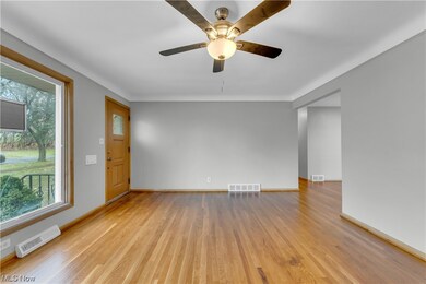 Spare room featuring light hardwood / wood-style flooring and ceiling fan
