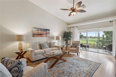 Living room featuring high vaulted ceiling, ceiling fan, and wood-type flooring