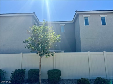 View of back of home with fence