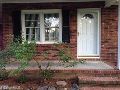 Entry. Front porch has room for a few rocking chairs for a place to relax