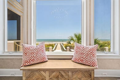 Sitting room with healthy amount of natural light, a water view, and wood finished floors