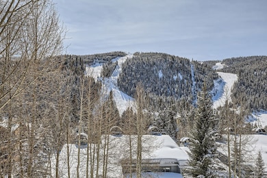 Property view of mountains with a view of trees