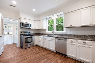 The chefs kitchen features LVP Flooring, Fresh pai