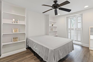 Bedroom with wood finished floors, recessed light