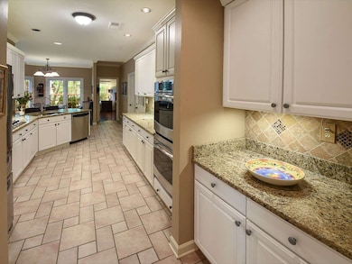 Off the dining room  and leading to the kitchen is
