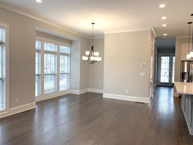 Unfurnished dining area featuring ornamental moldi