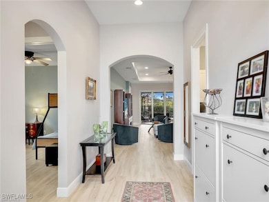Hallway featuring light hardwood / wood-style floo