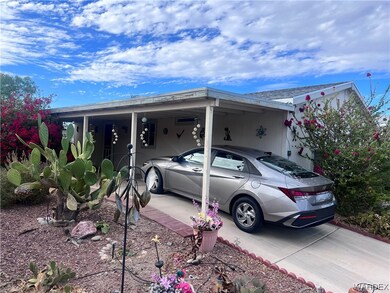 View of front of property featuring a carport