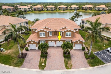 View of front of home with stucco siding, a water