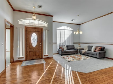 Foyer entrance featuring visible vents, a notable 