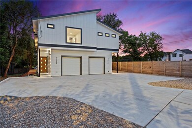 Property exterior at dusk featuring concrete driv