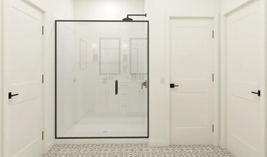 Primary bath with glass shower enclosure