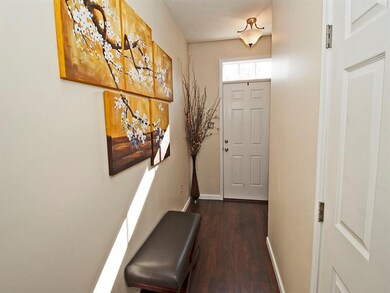New Warm walnut wide plank flooring traces the ent