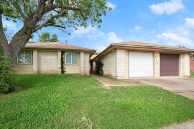 View of front of property with driveway, a front 