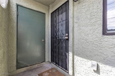 View of exterior entry with stucco siding
