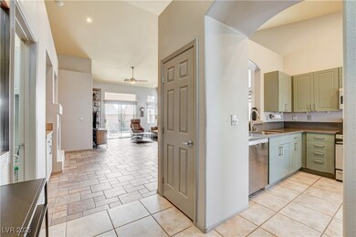 Kitchen featuring dishwasher, a sink, open floor p