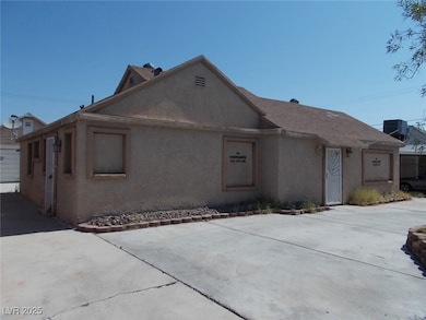 Ranch-style house with stucco siding