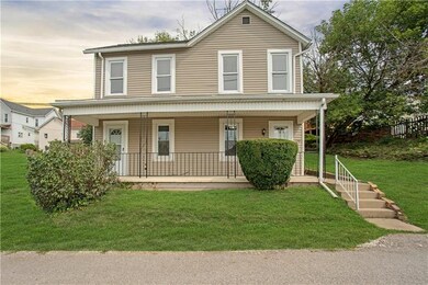 Another view of front exterior accenting some land
