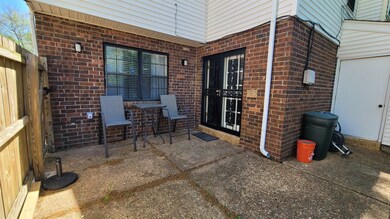 View of patio with fence