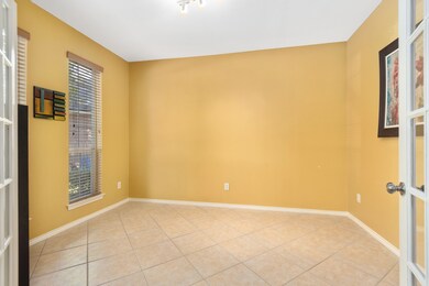 Study/Office with double french doors and plenty of natural light...faces out the front of the house where you have a great view looking down the street.