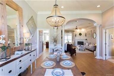 this view allows you to see the kitchen and den fr