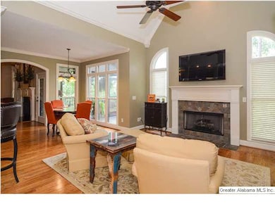 Keeping room area with vaulted ceilings and a seco