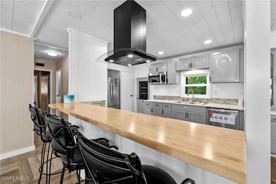 Kitchen featuring appliances with stainless steel