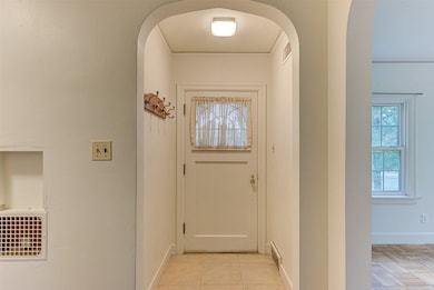 Doorway featuring arched walkways
