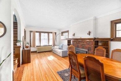 Dining space with ornamental molding, a textured c