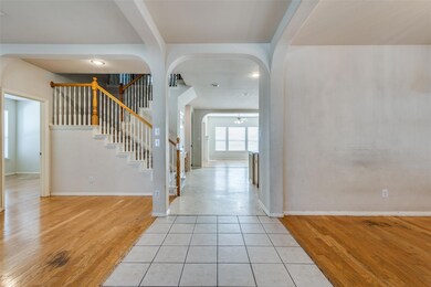 Foyer entrance featuring a notable chandelier and 