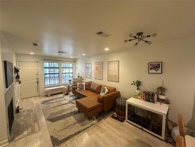 Living area with recessed lighting, light wood fi