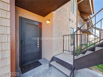 View of exterior entry featuring stucco siding