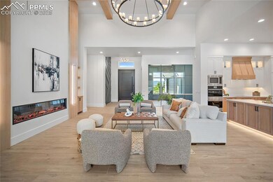 Great room with stunning electric fireplace and 18 ft ceilings