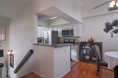 Kitchen, dining area, and stairwell