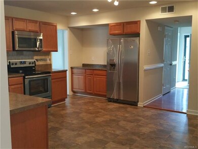 View of Kitchen - All New SS Appliances, door to l