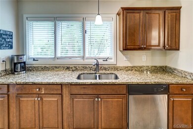 Kitchen has granite countertops and plenty of cabi