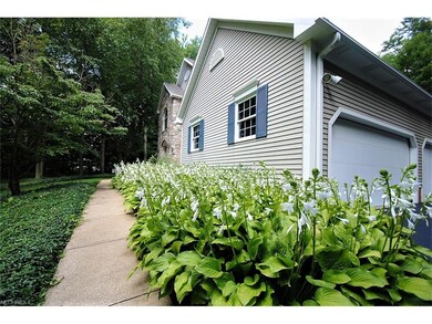 Lovely gardens line walkway to front door