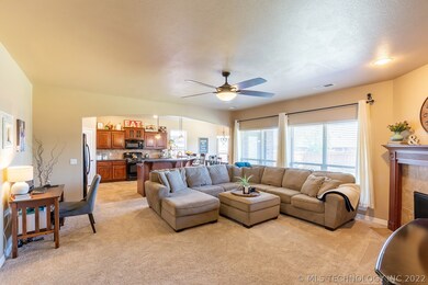 Huge Living Room opens to an even larger Kitchen!  Wall of windows allow in warm, bright eastern sun!