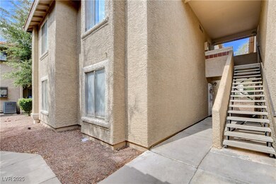 View of property exterior with stairs, stucco sidi