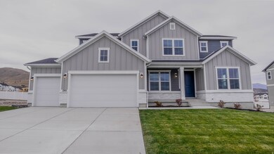 Craftsman-style home featuring board and batten siding, covered porch, concrete driveway, and a front yard