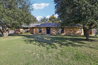 Single story home with brick siding