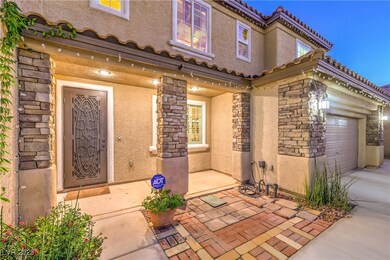 Doorway to property featuring stone siding, stucco
