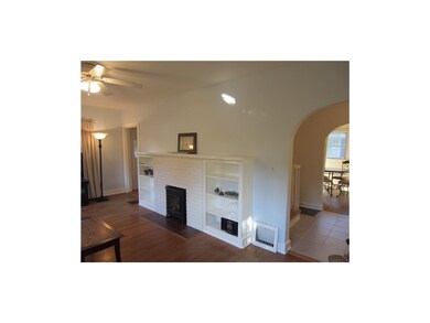Wood burning fireplace in living room with built i