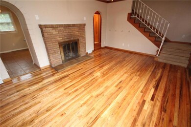 Main Living Room with Entry Into Kitchen and Acces