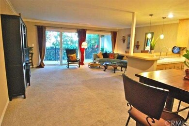 Large living room area with expansive balcony and 