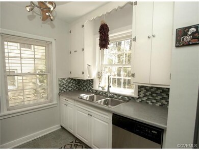 Kitchen with new countertop & backsplash.